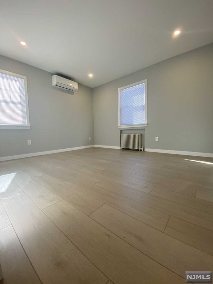 Gut renovated apartment waiting for its first tenants!!! This 2 bedroom plus basement apartment features a large living room, renovated kitchen, beautiful bath and two bedrooms on the first floor, as well as a sliding glass door to the patio out yard, as well as the backyard and parking for 2 cars. The finished basement has a family room, an office area, and a full bathroom that includes a washer and dryer. All of this while being very close to Ridgewood, NYC transportation, and major highways, this is what you have been waiting for!