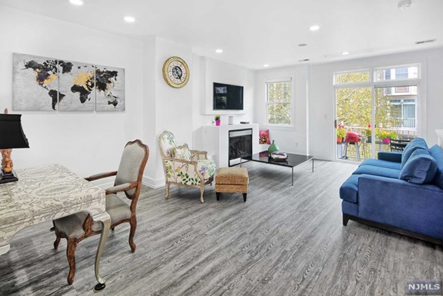 Showcase Delaware style home!!! This floor plan is one of only styles with three bedrooms on one level. New A/C and heating systems. New flooring on first floor. Fireplace. Partial NYC views. Refinished stairs and railing. Renovated master bath and powder room. Large walk-in shower in master bathroom. Custom painted. All new stainless hinges and lever handles throughout. Lots of storage. Parking for two cars; one in private renovated and heated garage and one in driveway. Popular community features two pools with Jacuzzis, tot lot, waterfront promenade and free shuttle bus to NY Waterway Ferry and Light Rail. Steps to 158 bus to NYC. Pet friendly. Close to restaurants and shopping. MUST SEE!!