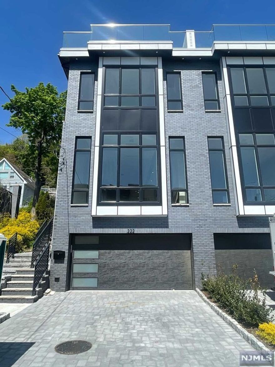 New Construction Duplex on an oversized lot with Hudson River Views. 4 levels with 10ft ceilings and private elevator, 4-bedrooms, 3-baths and 2-1/2 baths and a wonderful rooftop deck. This impressive Duplex has a modern design with dark brick exterior and Hardie siding with large wall of glass and Anderson windows throughout. Oversized kitchen with professional grade appliances and 8ft center island, and floor to ceiling tile linear fireplace. Top floor has a wet bar and entertainment room with access to the Roof Deck.