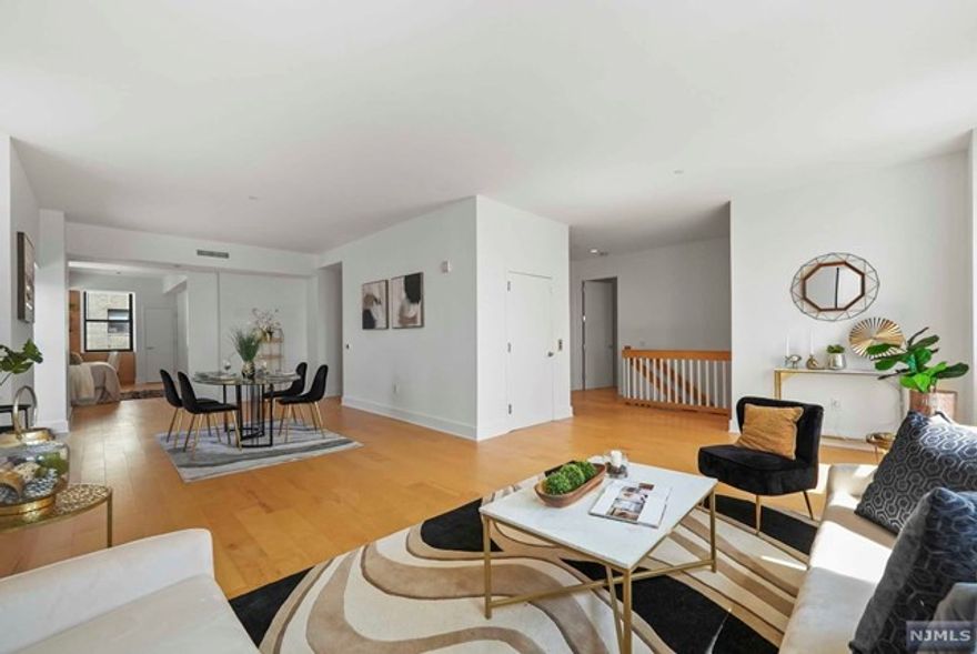 PH #1810 boasts 4 bds, 2 full bths & 3 half bths across 2 flrs & 3,200 interior sq ft & 2300 exterior sq ft & truly allows a discerning buyer to live like a king min from NYC. You enter to an open receiving area with 1 of 4 bds on your right. Used as a media room it makes for a wonderful suite for guests. Up the full staircase with a glass Art Deco chandelier you find the primary suite with walk-in closet and en-suite bath as well as access to the1st private deck. The living rm has views of NYC & Lady Liberty & the formal dining area is able to seat a dozen friends! This is also the access point for the 2nd roof deck. Off the dining rm is the 3rd bdr used as an office &guest rm. Down the hall to the renovated eat-in kitchen open to the 3rd deck. Down the hall there are 2 half bths, laundry, storage & the final 4th bdrm. The amenities, extensive! Pool, sauna, grotto, play rm, billiards, gym, yoga rm, path shuttle, parking & more! At PH #1810, you are on the top of the world!