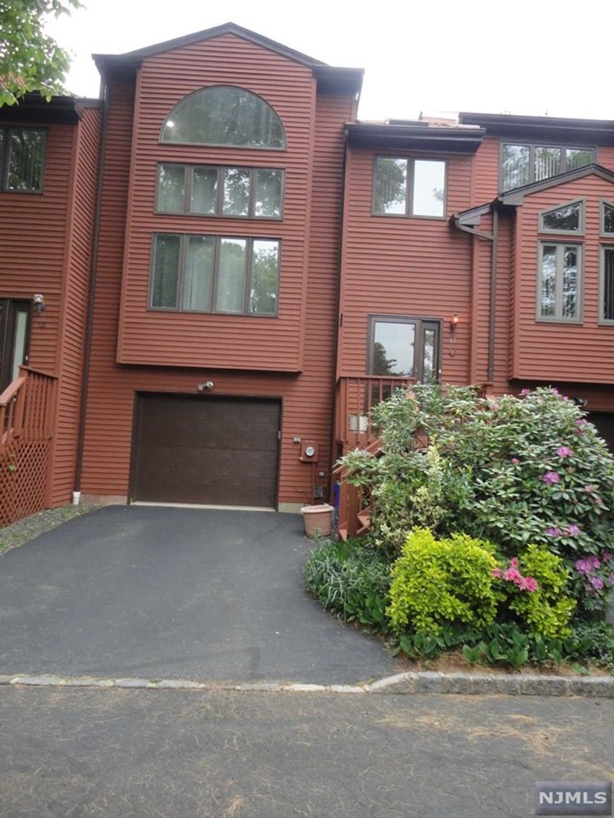 Look no further! This unit will check off every one of your boxes! Enter into this beautiful, spacious townhome boasting an entrance foyer w/skylight, newer kitchen w/corian countertops, ss appliances and a seperate d/a w/sliders to a large deck! Inviting f/d/r and a lovely l/r w/approx 20 ft vaulted ceiling! Add a brand new heating and cooling system, newer h/w heater, newer garage door, first floor lndry rm., attic fan and a fantastic, serene yet convenient location and you have a true gem! Dont miss this one!