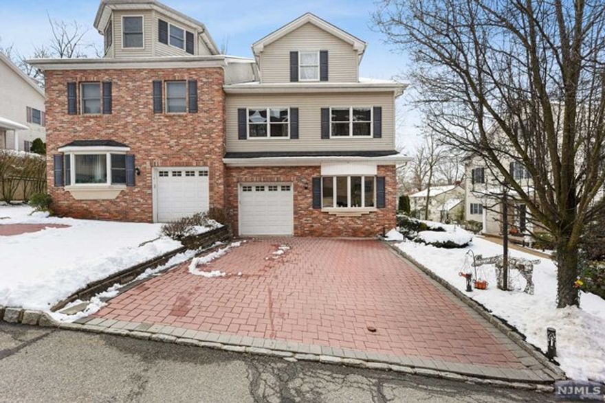 Welcome to this delightful bright and sunny luxury townhome located at 22A Lane Ave in Caldwell NJ. This stunning 5 bedroom, 4 full bathroom townhome was built in 2004 with a 1 car garage and offers three levels of living plus a huge finished basement with an exercise room plus a home theater with chaise lounge movie theater seating for 4 and an 11" diagonal screen. The first floor level of this home offers a welcoming foyer, formal dining room, full bathroom and an open floor plan in the main living area. Enjoy the beautiful gourmet, eat-in kitchen with maple cabinetry, granite countertops, stainless steel appliances, a large center island with breakfast bar and separate eating area. Family room has a gas fireplace and sliders that gives you access to the yard with a paver patio and BBQ grill which is great for entertaining guests! This lovely home offers a huge luxurious primary bedroom suite on the second floor level which has a large custom built walk-in closet.