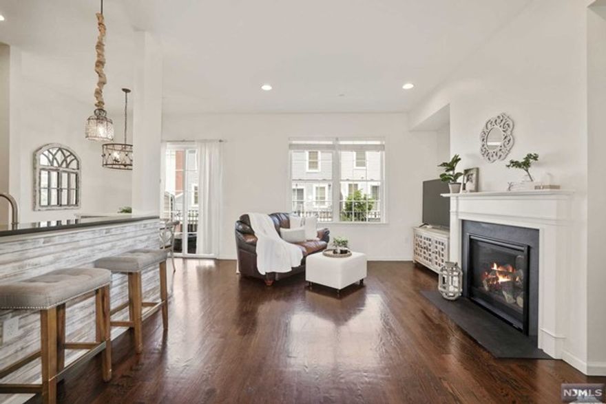 Your new home is here ! Located in Bergen County's most prestigious townhome community, your sophisticatedly designed home boasts 4BR/3.5BA, 2,258sqft (approx) with an upgrade of "Ground floor Bedrm Bathroom Suite". From manicured lush green courtyard, make your way to the entry foyer that impresses you with its Tall Ceilings & Windows. The entertainment ready floor offers a formal dining area, breakfast nook, buffet hallway, large outdoor deck, and a statement cozy fireplace, tying perfectly with open layout living & kitchen areas. Be charmed by generous sunlight on all levels, multiple storage closets, 2 car spacious garage + 2 car driveway, upgraded appliance package, recessed Lights, Dual Thermostats, Dual Heating & Cooling Zones, Hardwood Floors, Gourmet Kitchen, Window Treatments, & Custom backsplash, to name a few. Get used to On Site NJ Transit Train Station, multiple children's playground, parks, dog park, onsite coffee & wine store & connectivity to all major highways