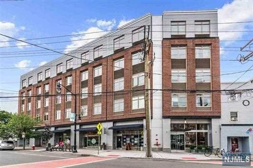 Location, Location, Location, 5-minute or less walk to Grove St path station!! This building has it all Rooftop deck, courtyard, fitness room, and resident lounge. This stylish 1 bedroom unit with an open floor plan and 10-ft ceilings bring in a lot of sunlight with its larger southern exposure windows. The bedroom has a large walk-in closest perfect for storage, and plenty of clothes. This building and apartment are super clean, and sleek. Parking may be available for a fee in the building!!