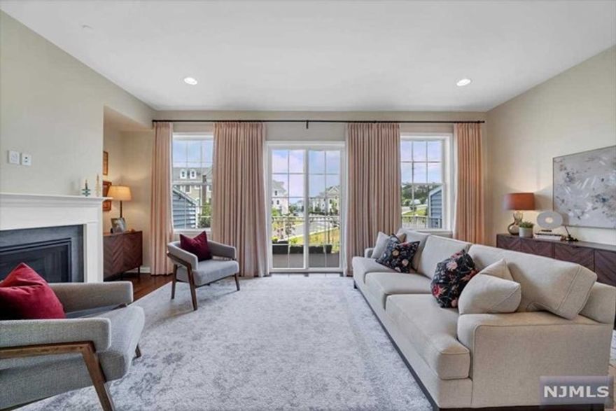 Move-in Ready Aug 12th. Finest & rare colonial style Luxury townhome awaits its first tenants. This magnificent home spans across three levels of modern spacious living offering spectacular ONE-OF-A-KIND views & SOUGHT AFTER location in prestigious Bergen County.Beautifully manicured green lawn, colorfully arched flower walkway welcomes you in. 1st level offers impressive tall ceilings, entry way, 1 coat & 1 shoe closet,attached 2 car garage & a bedrm w/attached bath. On the 2nd fl find unobstructed views from living rm DECK, tall windows,fireplace,modern kitchen,breakfast bar, pantry,powder rm & a large dining rm. Upstairs find primary suite w/2 WALK-IN-CLOSET & an attached bath w/stan-up shower. Additionally, you have 2 other bedrms, full bath & a spacious laundry closet. Easy & Quick commute:Steps away from WoodRidge Train station & NJ bus(comes every 10 mins,directly goes into Port Authority). Community offers: MULTIPLE sports fields, playgrounds & retail shops.