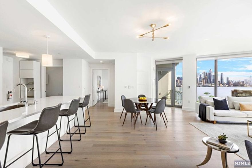 THE CHEN AGENCY presents NINE on the HUDSON Residence 909. This superb home has 1425-sf and boasts the most sought-after southeast Hudson River and New York skyline views from one of the best positions in the building. An amazing floorplan features high ceilings with floor-to-ceiling windows, split bedroom wings, south facing terrace and a central living & dining space anchored by a spectacular white-on-white kitchen. This building's exquisite finish package includes gorgeous wood floors, marble & stone surfaces, custom selected hardware and high-end appliances. Amazing building amenities include 24-hour concierge service, beautifully appointed resident lounges & entertainment areas, vast health club facilities, rooftop outdoor lounge and a spectacular outdoor pool deck. Taxes are based on the PILOT abatement program. A second parking space is available for $25,000. Contact NELSON CHEN at 201-886-8000 or Nelson@ChenAgency.com