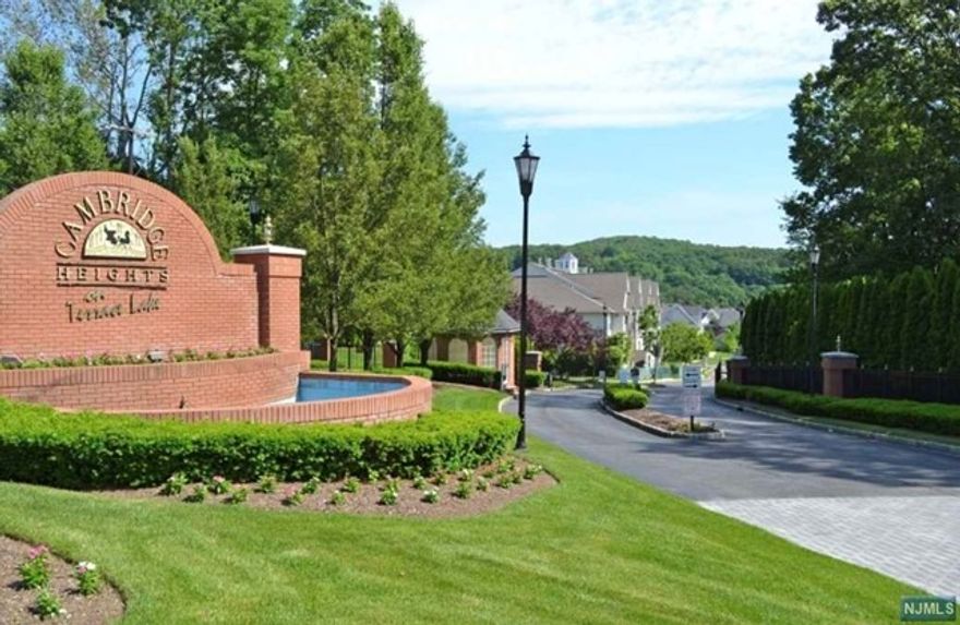 Welcome to the epitome of luxury living at Cambridge Heights on Terrace Lake! One Floor living!! Move-in ready, 2 Bedroom 2 Bath, First Floor, End-Unit Condo in this exquisite gated community welcomes pets and boasts a Private Clubhouse w/fitness room, an outdoor pool and nearby walking trails! Enjoy entertaining in your open-concept living room and recently updated kitchen with stunning quartz countertops and dining area that leads to your own private patio for relaxing or BBQ'g, The Primary Bedroom boasts two large closets and an ensuite Bath, while the versatile second bedroom sits across from the second, full hall bath and laundry/utility room. NEW: Dishwasher; quartz countertops; hot water heater; Central Air and nest thermostats. Close to shopping, transportation and a prime location just off of Rte. 23, offering unparalleled convenience.