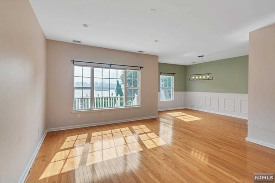 3-Bedroom, 2.5-Bathroom Duplex Townhouse with Direct Hudson River and NYC Views. This spacious townhouse has it all: stunning views, spacious rooms, and convenient location.The first floor features a modern kitchen with stainless steel appliances, a large living room and a dining area with hardwood floors. The second floor has two bedrooms, one full bathroom, and a master bedroom with a walk-in closet and private bathroom. The townhouse also has a large balcony and private patio, as well as one garage parking space and two additional parking spaces in the driveway.The townhouse is located just a block away from NJ Transit buses, mini buses, and a shuttle to the ferry. It is also within walking distance of a beautiful Hudson Park with tennis courts and more. And just a couple of blocks away is Edgewater, a vibrant waterfront community with shops, restaurants, and bars. Call today to schedule a viewing!