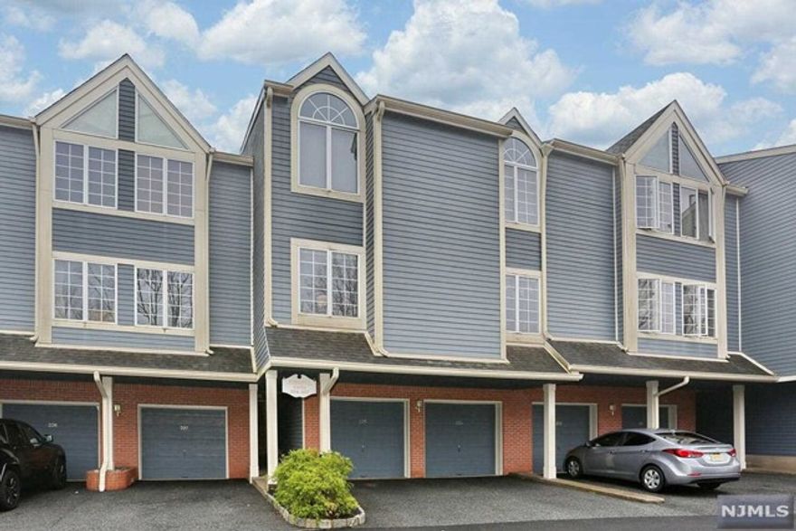 Welcome to the lovely gated community of Cambridge Heights! This 2 bedroom 2.5 bath unit is ideally located, close to the pool & club house. This particular home was originally the model unit that features unique built-ins, mirrored walls & pretty hardwood flooring. Upon entry, you are welcomed in by the open concept floor plan that is perfect for entertaining. The spacious living room has a wood burning fireplace flanked on either side with french doors leading to a covered balcony. Outside the front door there is also a communal covered gazebo area that overlooks the peaceful yard. The kitchen has been nicely updated with granite counters & stainless steel appliances along with a breakfast bar. The main bath was also updated. The primary bedroom has 2 closets & an attached bath. The lower level family room offers great space including a powder room, laundry & is conveniently attached to the 1 car garage. Don't miss all of the amenities this coveted community has to offer!