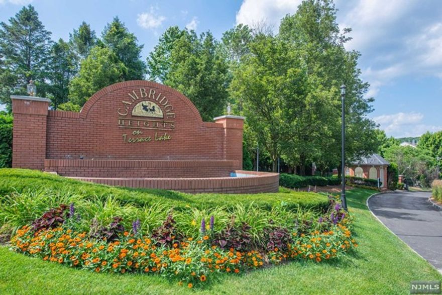 Another outstanding unit at Cambridge Heights! This gated community offers so much to its owners including gym, large club house and a pool to enjoy on these summer days! As you step inside this second floor unit, you will be amazed by its openness and high ceilings (nine feet). Bright and spacious kitchen with SS appliances, granite countertops and openness! Enjoy eating from your dining room and looking into your living room with a gas fireplace that also has sliders to your private balcony. Two sizable bedrooms including master bedroom with ensuite, tray ceiling and full walk-in closet that is sure to please. Lets not forget the laundry room, which includes an extra storage area. This end unit condo is pet friendly and is easy to commute to anywhere including Routes 23, 287, 80 and mins from stores, shops, and your local pub. There is also and elevator if needed. All this and a great place to kick back and RELAX! Make your move today.