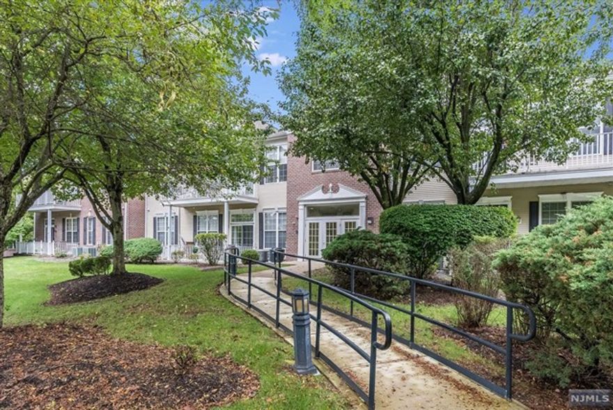 Well-maintained 1st floor Dogwood unit in Four Seasons featuring 2 beds and 2 full baths. Enter into main living area where you will find the spacious living room, dining area & kitchen. Large window in the living room & sliding glass doors that lead out to the veranda allow for plenty of natural light to fill the room. The kitchen offers custom cabinetry, granite countertops, breakfast bar & small dining area. The primary suite is super spacious featuring large walk-in closet, addt'l closet and en suite to include stall shower and storage vanity. Addt'l bedroom also offers ample closet space & there is a full bath right outside featuring storage vanity & tub shower. The veranda overlooks association grounds & walking path & is the perfect place to enjoy some fresh air. One parking spot is located in parking garage underneath unit w/ elevator leading up to 1st floor. There is also a small storge unit directly in front of the spot. Community offers clubhouse, tennis courts & pool.