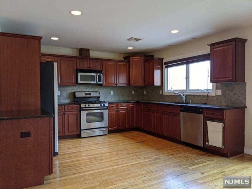 Modern 3 bedroom 2.5 bath townhouse available for rent! Spacious floor plan unit with 3 levels of living space. Built in 2006. Living room with gas fireplace. Formal dining room. Modern eat-in kitchen with granite counter tops & stainless steel appliances. Central vac and air conditioning. Full, finished basement can be used as family room with lots of storage space. Washer and dryer in unit at bedroom level. Attached one car garage. Bright and sunny, energy efficient with excellent construction/insulation. Only 1 block from public transportation (156/159 express NJ Transit bus lines) and near restaurants and shopping. No pets. Available Immediately!