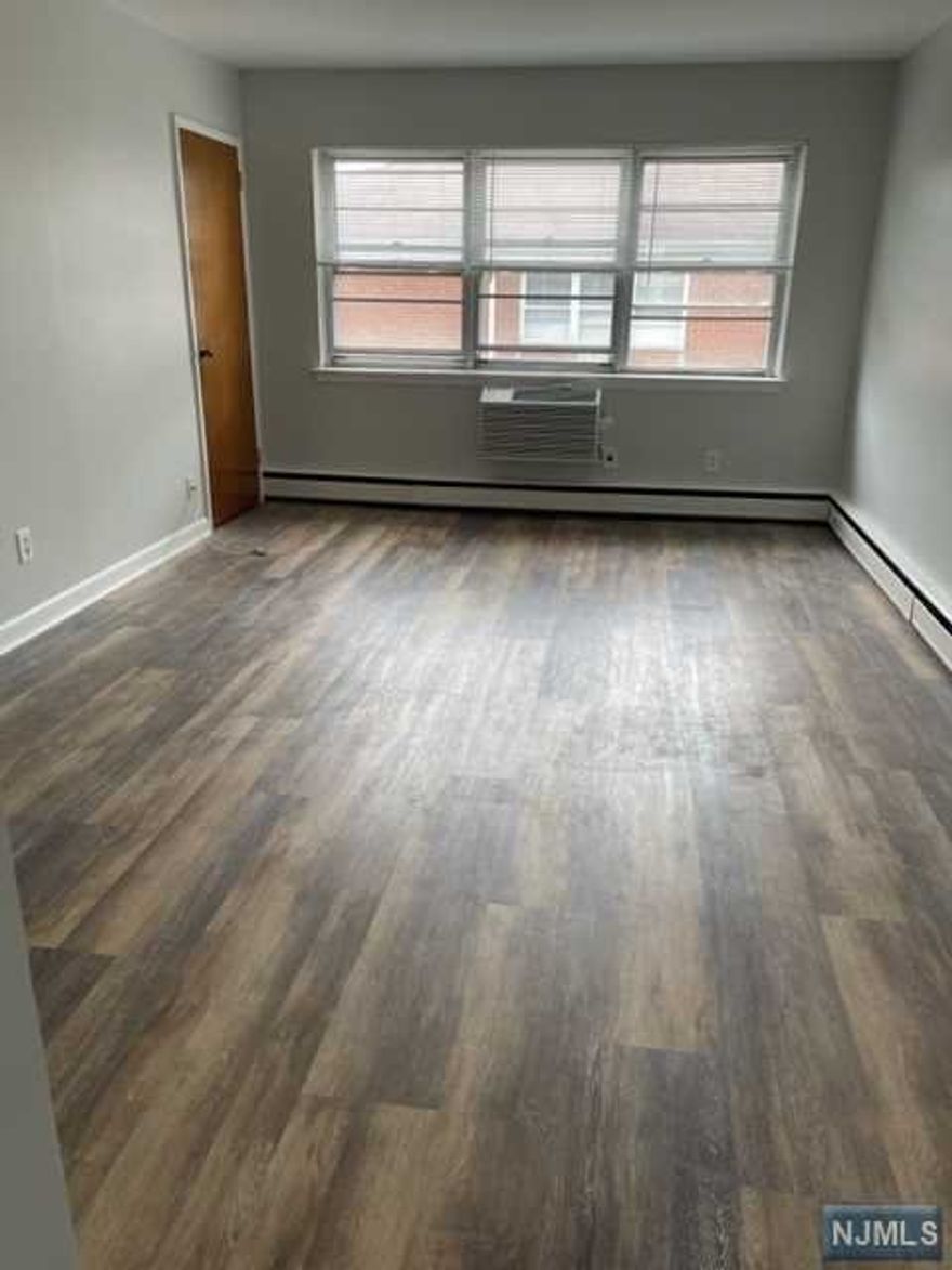 Large 2nd flr. studio apt conveniently located across from the Hackensack University Medical Center. Unit has been freshly painted, new floors and new A/C. Separate kitchen with refrigerator and oven and great closet space! Laundry in the basement and parking around the perimeter of the building for additional $75/month. Rent includes heat and hot water. No pets. Bus to NY only 1.5 blocks away and under .5 miles to NY train. Close to the downtown area! 1 month broker fee applies.