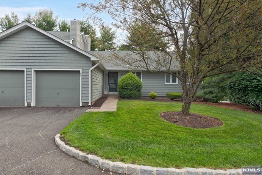 Rare opportunity! Updated ranch style & a corner unit in a great location. Entrance foyer with coat closet. Large living room with gas fireplace & dining room area with cathedral ceiling and entrance to deck. Kitchen is updated & has granite counters, center island, stainless appliances, GE wall oven, microwave & cooktop, Whirlpool refrigerator & Bosch dishwasher. Primary bedroom is spacious & has 2 double closets & 1 single. Primary bath is updated. 2 additional bedrooms on main floor & an updated hall bathroom. The laundry is on the main level as well. The large walkout basement is finished with a family room with sliders to a patio, bedroom, half bathroom and plenty of storage. Custom window treatments throughout. The unit has a one car garage with direct access to home. New roof on unit. The complex offers a pool, gym, tennis, clubhouse & more.