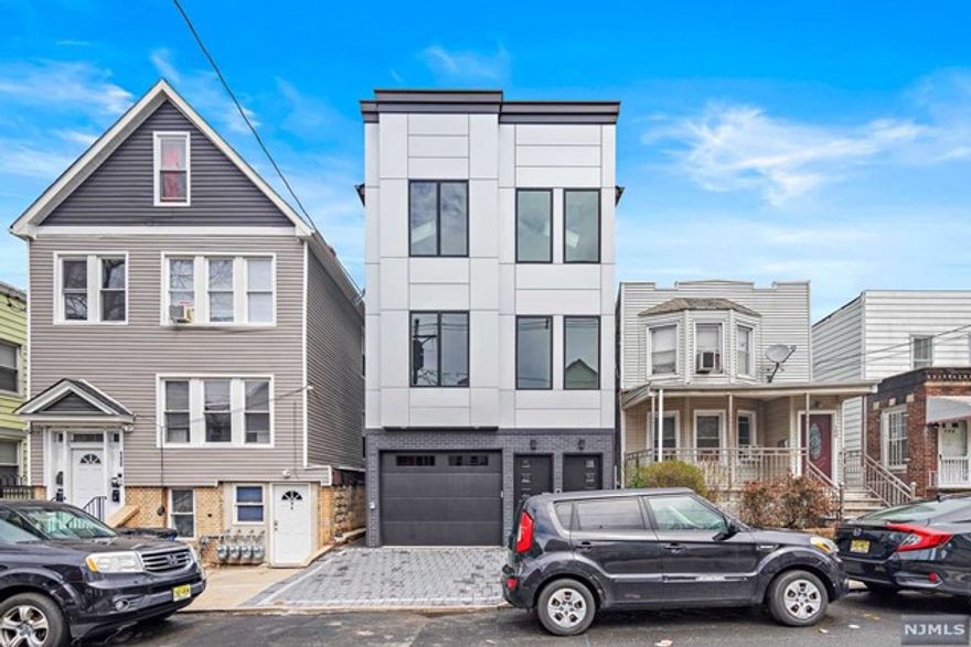 Brand new two-family construction in the West Bergen section of Jersey City walking distance from the West Side Avenue Station on the Hudson-Bergen Light Rail. The 2nd unit of this contemporary 3 story home offers 3 bedrooms and 2 bathrooms, spacious open concept living room and dining room area, ample closet space, large balcony, and laundry room. Unit also features a modern kitchen with quartz counter tops, stainless steel appliances, farmer sink and stunning waterfall island. Be the first one to live in this brand new unit, don't wait!