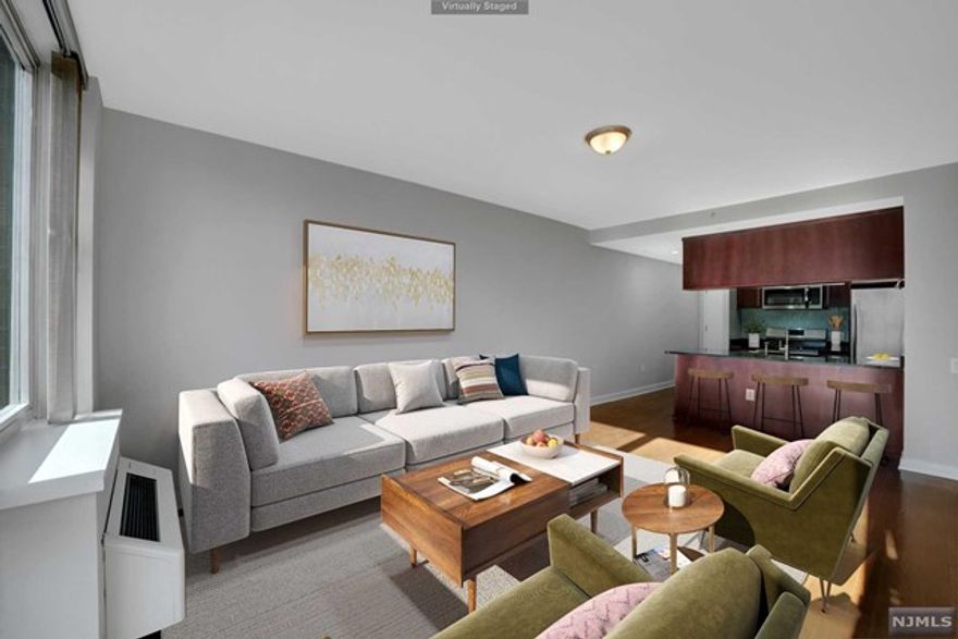 JUST REDUCED!! Large condo 1Br/1-1/2 bath, total GLA 841 sq.ft. with NYC view Balcony Access. Spacious living rm with high ceiling and tall glass windows for bright sunlight. New SS kitchen appliances like Gas range oven, Microwave and Dishwasher. Shiny glass backsplash and granite countertop. Beautifully refinished hardwood floor on hallway to large bedroom with true walk-in and additional double full height closets and master bath suite w/double sink, large tub and glass shower. Luxury high-rise building with full amenities including full concierge/doorman services, indoor pool, gym, yoga/pilates room, play room, furnished roof-top terrace with panoramic view of NYC and Hudson from G.W. B. to Verrazano Bridge. Convenience to all NYC bus and all shopping in next strip mall and hip/hot restaurants at door step. To help visualize this home's floorplan and to highlight its potential, virtual furnishings, enhancement may have been added to photos found in this listing. SELL AS IS.