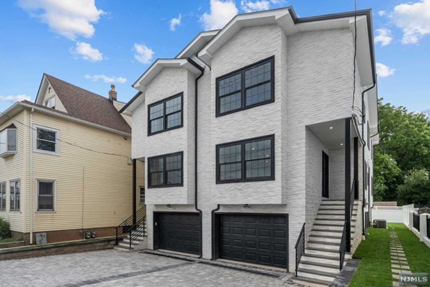 Spectacular and specious new construction on new foundation with top of the notch finishes duplex/townhouse featuring 2,600+ sqft. Commuters dream - only a few min walk from Plauderville Train station. Paved driveway and garage will fit a 3 Cars!. Step inside to a living room, dining room, sophisticated powder room, gourmet kitchen with waterfall island and backyard entry on the first floor. Upstairs you will find a master bedroom with magnificent and spacious double sink master bathroom. Additional two bedrooms, one full bathroom and laundry room. Ground level features one car garage, full bathroom, recreation room, office and entry to backyard. Forced hot air and central A/C dual zone, hardwood floors, beautiful white stone and black Pella windows. Real Estate taxes to be assessed. This is a self-managed Duplex/Townhouse that will require exterior common insurance that will be split by two units.