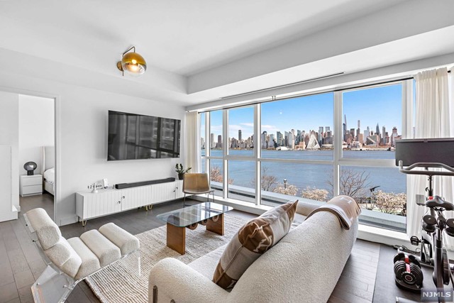 THE CHEN AGENCY (phone 201-346-8888) - Welcome to AVORA Residence 316. This is the one you've been waiting for! Located on the front row, this unit boasts direct Hudson River & Manhattan Skyline views that are truly mesmerizing. With 1477-SF, the split-bedroom floorplan is anchored by a central open plan living & dining area. Spectacular finishes include beautiful wood floors, quartz waterfall counters, contemporary cabinetry, exquisite porcelain tile, high-end stainless steel appliances and a curated selection of beautiful hardware & fittings. Building amenities include 24-hour concierge service, health club, media room, sports simulator, resident lounges and the amazing 3rd floor pool deck & barbecue patio. Avora residents enjoy NY Waterway Ferry service, Hudson/Bergen Light Rail & NJ Transit Bus service literally steps from the lobby door. Come experience living here! Contact NELSON CHEN at 201-886-8000 or Nelson@ChenAgency.com