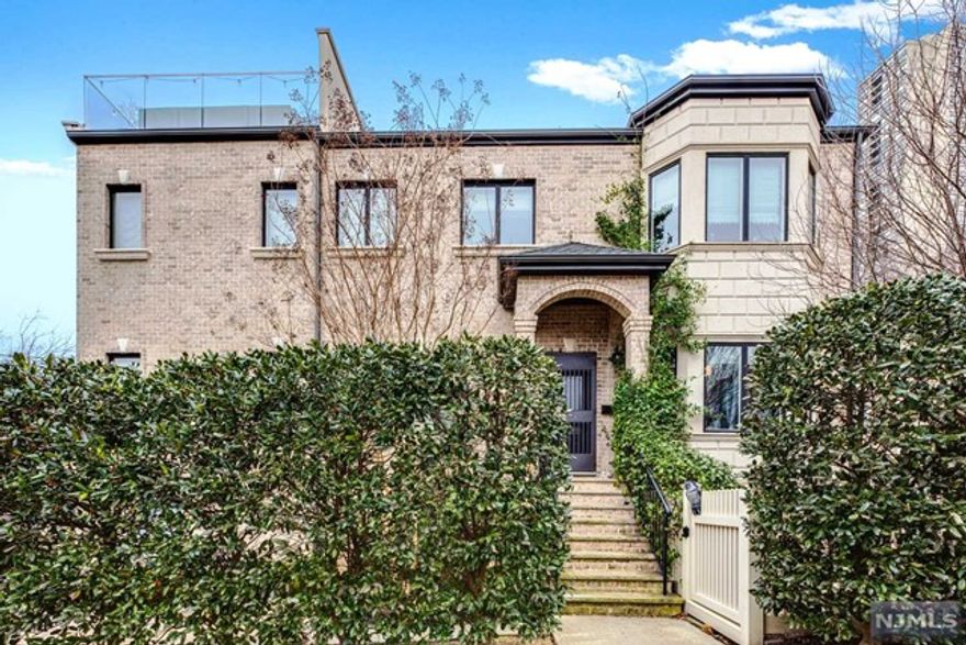 One of a kind 3/4 Bedroom Townhouse in the best location of Edgewater build in 2015. Unique design offers private entrance leading to the entry foyer with coat closet, oversized eat-in kitchen with the exit to the private patio, large dining room and living room filled with tons of natural light and powder room!Second floor features oversized master bedroom with his and hers walk-in closets, master bath with jet tub and walk-in shower.Very good size second and third bedrooms, full bathroom and laundry room. On the third floor you will find a wet bar and rooftop deck with beautiful views of GWB and NYC Skyline.Ground level offers an additional bedroom (rec room, gym, office, playroom) with full bathroom.Full size 2 car garage with large driveway for 2+ cars and additional private outdoor parking!Best street of Edgewater, with plenty of street parking for the guests,3 minutes from GWB, bus stop to NYC,GW elementary school around the corner, close to all grocery stores and shopping.