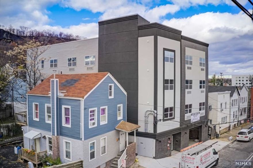 Discover luxury living in a new 2-bedroom, 2-bathroom apartment, nestled within a boutique (9-unit) mid-rise apartment building with elevator (and stairs). Apartment features primary en suite bathroom, in-unit GE washer/dryer, stainless steel GE appliances (electric range, over-the-range microwave, dishwasher), and a Frigidaire Refrigerator, all designed with energy efficiency in mind. Stay comfortable year-round with the PTAC wall cooling/heating system. Security meets innovation with the ButterflyMX system at the lobby door and smart locks for each apartment.An application fee of $40 per applicant applies. Pets are allowed with conditions for a $50/month per pet fee. Limited indoor and attached garage parking is available for a $150/month fee. Tenants have the flexibility to opt for a security deposit insurance policy instead of a traditional up-front deposit. Tenant Insurance required.