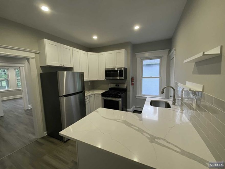 This beautifully renovated 1 Bedroom/1 Bathroom features a bonus room perfect for a Home Office. This second floor unit, boasts many windows and rich sunlight. Only a 4 minute walk to the Bloomfield Train Station, direct to NYC. You'll also enjoy an updated eat-in kitchen with large peninsula, solid surface countertops, stainless steel appliances, bathroom with shower, Living Room, nicely sized bedroom with closet, additional in unit storage, recessed lighting, shared backyard and on-site coin operated laundry facility. Watsessing Park, directly across the street, has great walking paths, athletic fields and new playgrounds. Minutes from Bloomfield College, this is also a great location for students. Tenant pays electric & gas plus cable/internet. No Pets. No Smoking. Security deposit, 1/2 month broker fee and first month's rent are due before move in date ($5,550 total). Applicants must provide proof of income.