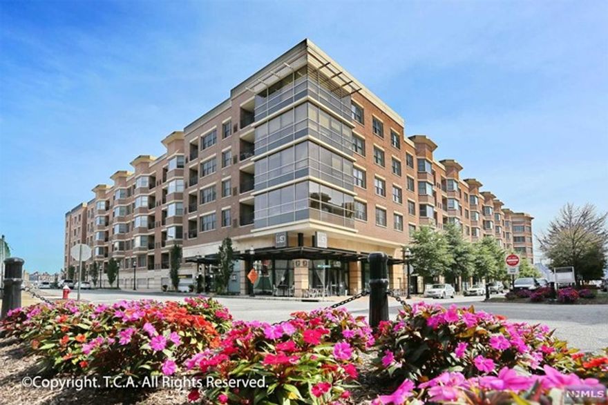 GRANDVIEW II - Welcome to Residence 422. This is a beautiful 2 bedroom, 1 bathroom home with 1127-sf and high ceilings throughout. A spacious floorplan provides an open concept main living area with an oversized bay window, separate bedroom wings and a lovely terrace. Updated kitchen with stone countertops and stainless steel appliances. Excellent closet space, oversize front load laundry in unit and a reserved garage parking space complete this distinctive offering. Building amenities include 24-hour concierge service, outdoor pool, gym, kid's playroom and resident lounge. Located in the heart of Port Imperial, easy access to NJ Transit Bus, Light Rail, NY Waterways Ferry, shopping and dining all within walking distance.