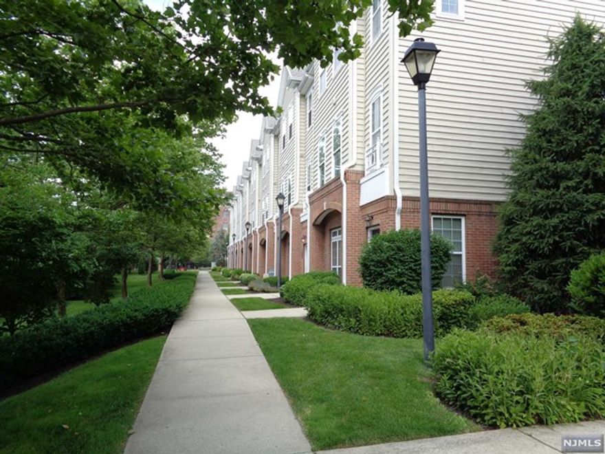 A beautiful and spacious townhouse with plenty of natural light, this 2100 sf. Grandville end unit is located in a gated community with plenty of security and much more! It has an open floor plan for the living room and the dining area and kitchen. Kitchen has granite counter tops. On the second floor, there is a larger foyer with built in desk and a bonus room that can be used as den/office/ guest room. Large master suite plus another bedroom and full bath. Also, the laundry-utility room is located on the second floor. One car attached garage. Close to transportation into NYC and downtown Belleville and Nutley. A great townhouse in a great location!