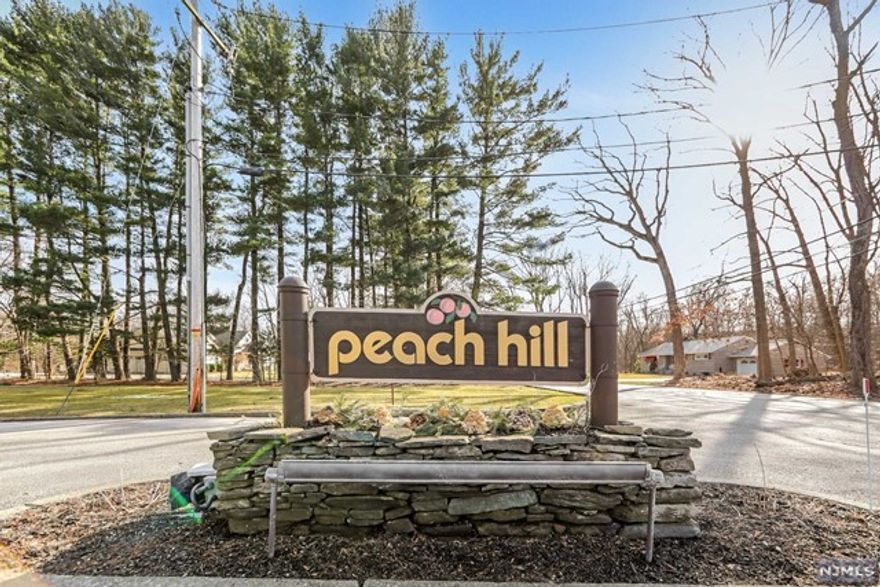 Spacious 3 Bedroom 2.5 Bath townhouse in Peach Hill Court with best location in the complex. This home has a large primary bedroom on main floor featured with a window facing a beautiful backyard lawn and walk-in closet. In addition there are 2 more big bedrooms on the upper floor with spacious closets. The main level also has a large living room, big laundry room, dining room and a huge kitchen. The living room has a sliding door to a deck which is surrounded with grassy area and woods. On the ground level there is a finished basement, a utility room that provides extra storage space and a 2 car garage with a long driveway. This lovely Peach Hill Court is a community in one of the best towns in northern Bergen County. It's not only nice and quiet, it's also very convenient, a few minutes to grocery stores, gas stations, major highways and schools. There is school bus service for K- HS. Complex also has a tennis court and play ground for kids.