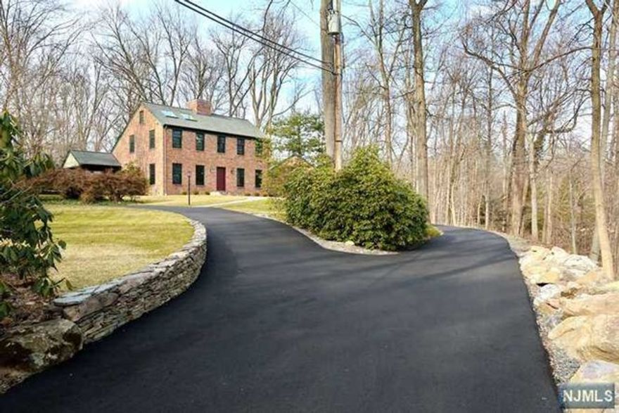 Dream Home, Fully Renovated 4BR/4.5BTH. Enjoy the peaceful privacy of park- like lawns surrounded by woods. Outstanding Craftsmanship, completely rebuilt interior; all new mechanicals, plumbing, electric, baths, kitchen. Close to NYC Train & Bus, Highly Rated School System w/Fabulous Shopping in the Surrounding Area. This Gem is Bright and Airy with Over Size Windows, Expansive Glass Doors Opening to the Outside Deck Off the DR & Kitchen. Open Kitchen with a Massive Custom Island, SubZero Frige, Miele DW, Wolf Range, Farm Sink, Lg Pantry, Lg Family Rm w/Vaulted Ceiling, Beams, Hardwood Flrs, Stone FP. Double Access to the Basement with Plenty of Storage, 2 Car Garage and Half Bath. 2nd Level Master BRw/Soaring Ceiling Oversize Windows, 2 Master Baths, Custom Closets, Skylights & FPL for decoration only, 2 more Bedrooms with a FBTH. 2 Car Garage, Circular DW Security System, Water Treatment, Sprinklers, Fire Alarm,Generator,2 Heating Systems, Wired Data, Sm Dog Considered by LL