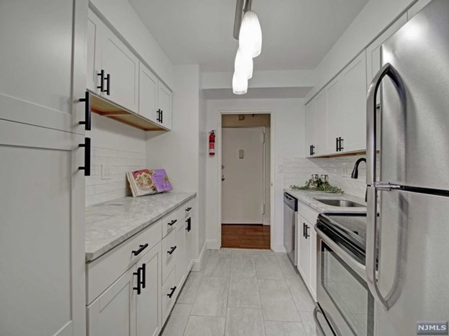 Why Rent? Be an owner for the same monthly amounts. Come Home to this 15th floor 2 bedroom, 1 bath NYC East facing skyline view COOP unit in a luxury high rise. New galley kitchen, bamboo floors, MBR with WIC and an extra closet spaces. This popular co-op features a 24 concierge, included utilities (electric, heat, hot water), underground parking ($60/mo), complimentary jitney to the NYC train, a backyard gorgeous "secret garden" and first floor gym all on the edge of Orange Park and just blocks from access to GSP and Route 280, this is one of the best choices in Essex County! Requires Coop financial board approval and 20% down payment required. Shares: 370. HOA includes maintenance, taxes and all utilities. See details on entrance requirements and fees.