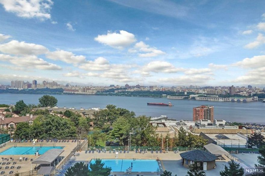 Sunny and bright, east facing 2BR/2BTH with a total of over 1500 sqft. Newly redone kitchen. Large master bedroom with dressing room and walk-in closets, spacious master bath. Sizable guest bedroom, full bathroom. Hardwood floors throughout. Ample closet space. Vast balcony with spectacular views of the Hudson River and iconic GW Bridge. Weatherproof enclosure allow you to enjoy those stunning views rain or shine. Spectacular amenities features indoor & outdoor pools, tennis courts, playgrounds, 24 hour concierge, Palisadium Health Club & Gym. Indoor parking $75/m. Easy commute, NYC Buses, shuttle to ferry.