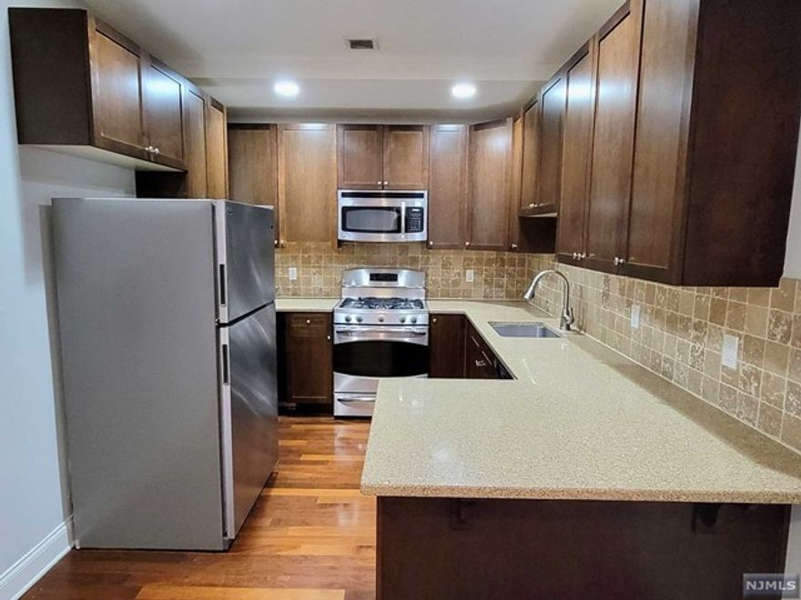 Best Price in Hackensack for Top Floor Unit with 1220 square feet! Newer Condo Building with Modern Amenities that include Open Concept Living, Washer/Dryer in unit and Spacious Gym with New Equipment. Kitchen has Lots of Cabinets, Stainless Steel Appliances and Granite Countertop with Seating. Other features include Central Air, Crown Molding and Recessed Lighting just to name a few. Two Indoor Parking Spaces included! Pet Friendly building. Conveniently located just steps away from Bus Stop, Essex St. Train Station, Stores, Restaurants and more. Walking Distance to Hackensack Meridian Health and Bergen County Courthouse. This is a True Must-See! Building is VA approved; not FHA approved. Investors welcome, can rent out immediately!