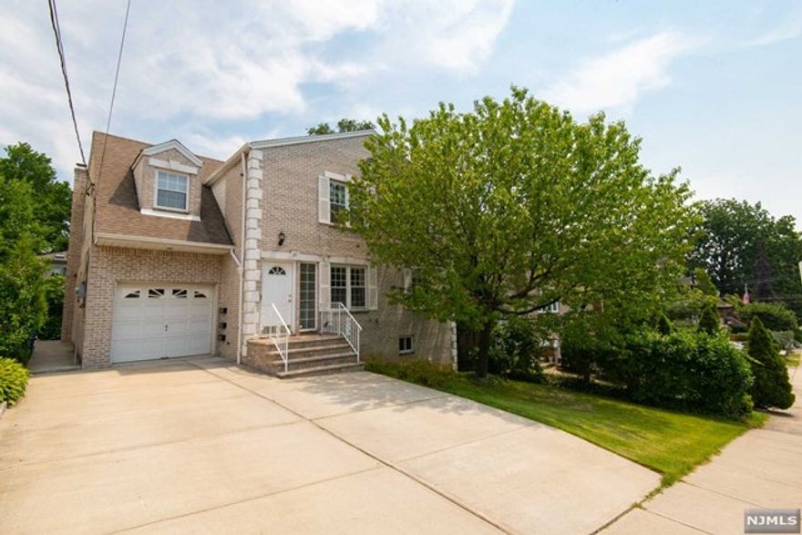 Spacious and well-maintained multi-family home in prime location of Fort Lee. First floor is a open floor two bedroom unit with fully finished lower level basement, perfect for guests or additional family members with seperate entrance. The kitchen is expansive with granite counter tops, and large island with built-in storage underneath. Floor to ceiling tile in all bathrooms. Washer and dryer in unit. Plenty of off street parking, nice backyard space for grilling, and close to schools. A commuters dream to NYC with 5 minute access to all major NJ highways! School #1! Excellent opportunity for family living!