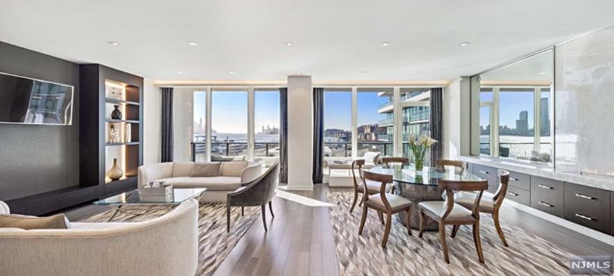 THE CHEN AGENCY presents AVENUE COLLECTION 1200 - Residence 509 is a true masterpiece executed with extraordinary precision, quality and exquisite design sensibility. Originally a 3-Bedroom home, the 1773-sf floorplan has been reimagined into the most luxurious 2-Bedroom home with spectacular southeast Hudson River and Manhattan Skyline views. Exquisite materials include the finest selection of woods, natural stone, hand selected fixtures and high-end appliances. Spectacular custom designed and fitted built-ins offer both beauty and practicality. Magnificent Lutron controlled lighting, floor-to-ceilings windows and the full length glass walled terrace add the final touches to this signature Port Imperial home. Owner is a Licensed NJ Real Estate Agent. Contact NELSON CHEN at 201-886-8000 or Nelson@ChenAgency.com