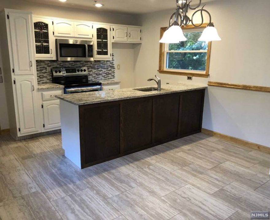 Welcome To This IMMACULATE, Completely Renovated Unique Apartment Situated On Pretty Tree Lined Street. GORGEOUS Kitchen With Granite Countertops And All Brand New Stainless Steel Appliances! Large Dining Area With A Boxed Bay Window That Brings In Tons Of Light. Core Tech Vinyl Tile In Kitchen And Dining Areas.Large & Airy Bedroom With 2 Double Closets, New Refinished Hardwood Floors. Bright And Sunny Living Room With Beautiful Stone Fireplace And Newly Refinished Hardwood Floors Also, Plus A Back Door Leading Out To An Amazing Pergola With Beautiful Views! Nice Size Updated Bathroom With A Kohler 5 Jet Whirlpool Tub! Laundry Room With Hookups! Central Air! Security System! New Windows, New Doors, New Molding! Close To NYC Transportation, Stores Etc. This Is Truly MOVE IN CONDITION!! No pet! NO EXCEPTIONS! NO SMOKING!