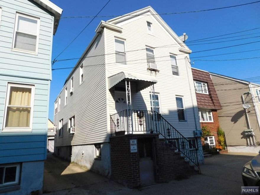 2nd floor apartment. LR, Large EIK, 2 BRs, Den, Full Bath. Hot water baseboard heat and window AC. Close to PATH. Tenants responsible for electricity, gas, heat, AC. Parking in rear for extra $100. Landlord pays 1/2 realtor fee.