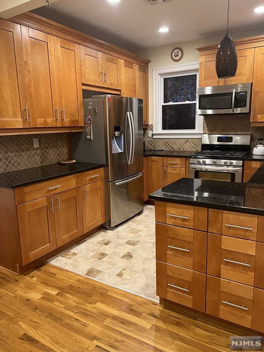 Absolulety stunning first floor 3-bedroom, 2 full baths apartment. This unit offers full use of yard and 2 car garage. You will find here upscale kitchen, all SS appliances, granite countertops, hardwood floors. Unit is available with washer/dryer and refrigerator. Tenant will have full use of yard and 2 car garage.