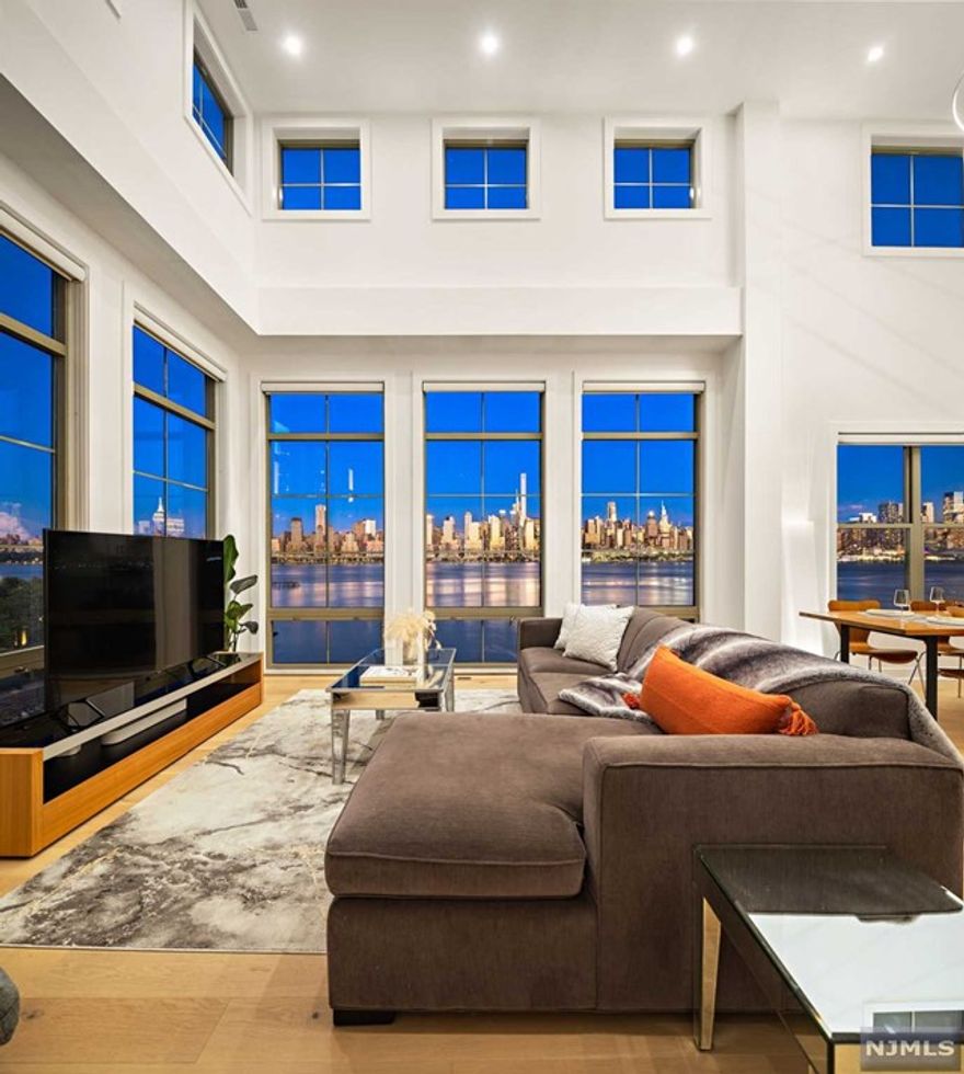 This northeast corner waterfront unit offers a rare combination of space, light, and value. Featuring three bedrooms plus a loft, two bathrooms, and soaring 20-foot ceilings, this residence is flooded with natural light and offers panoramic, unobstructed views of the iconic New York City skyline. With a spacious layout, incredible ceiling height, and direct waterfront location, this home presents unparalleled value at $1,500,000. A truly unique offering that blends space, views, and waterfront living opportunities like this don't come often. Swim, exercise, shoot pool &hoops, work, watch movies and socialize at the Hudson Club, a community of condominiums that rests beneath the shadows of the Greatest City in the World.