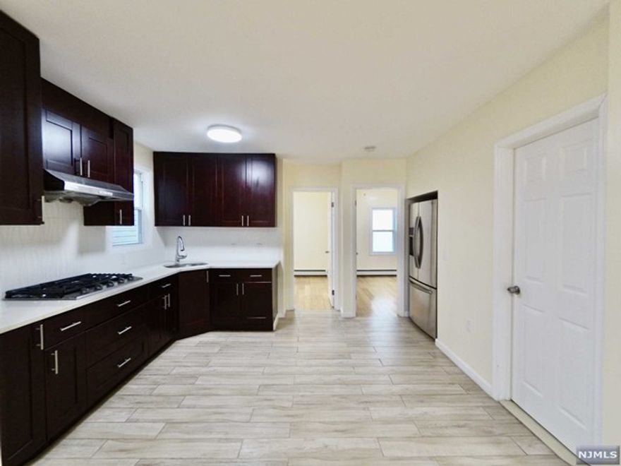 Beautiful fully renovated 3 bedroom/1 full bath apartment, conveniently located in the center of secaucus. Newly painted. Open floor plan. Modern kitchen features new cabinets,stainless stove and hood. Large modern bathroom with tiled floor/wall and tub. Wood flooring throughout. Ample sunlight and ample storage. Washer/dryer. Water is paid by landlord. Strictly no pets. Street parking. Easy commute to Manhattan. Close to school, bus, parks,shops and restaurants. Must see it!