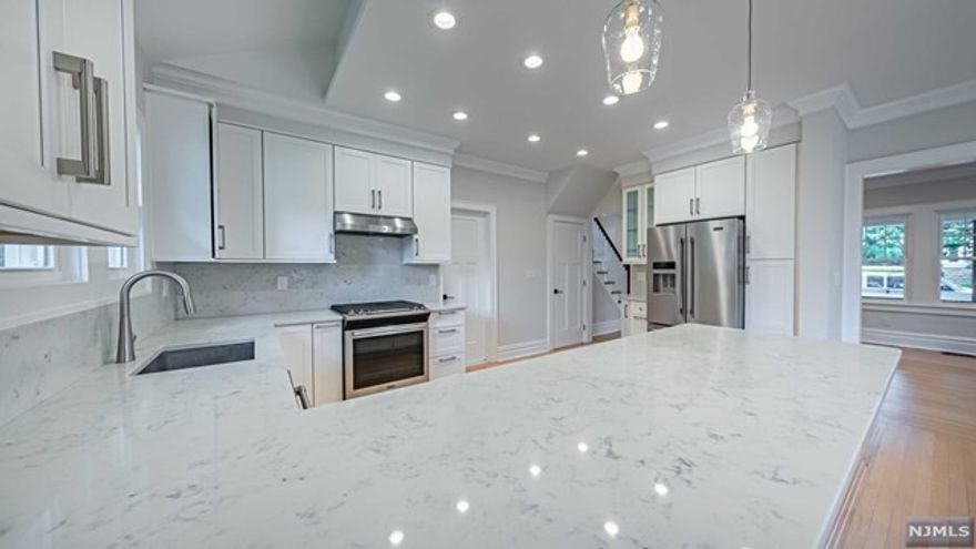 Welcome to Leonia! This amazing colonial was completely renovated 5 years ago and has been restored to its original beauty with modern amenities that will be sure to impress. Large living room open to dining area, open to updated eat-in kitchen with peninsula, counter height seating featuring quartz countertops and SS appliances! Rounding off the first floor is an updated full bath with a stall shower and a side entrance off of the kitchen. Upstairs features three large bedrooms, and an updated full bath with a tub! Third floor features a finished attic perfect for a bonus for an office or playroom! All new recessed lighting, 2 zone central air, Unfinished basement is perfect for storage and there are laundry hookups available. 2 car detached garage! Only a couple blocks away from Leonia's vibrant downtown! Around the corner from NYC transportation! Do not miss this one! Tenant responsible for landscaping and snow removal.