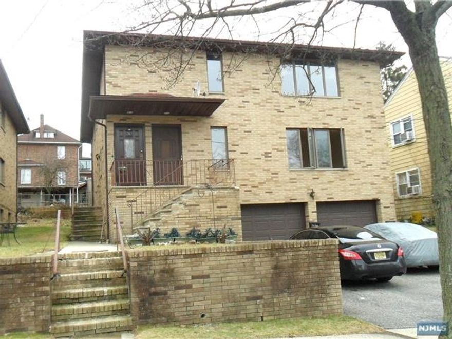 Fully renovated large 8 room bright apartment located on the first floor with all utilities included. Consists of 3 bedrooms, 2 full baths, living room, formal dining room, eat-in kitchen and tiled foyer with closet rest of apartment has beautiful refinished hardwood floors. Master bedroom has a separate bath, with two closets, one of which is a walk-in. Kitchen has a separate entrance with new self-closing cabinets, tiled floor, quartz countertops, and new stainless steel appliances. Central air conditioning and on-site laundry. One car parking in garage and an additional parking space in the driveway. Located near elementary school, stores, restaurants, shops & NYC bus stop. All Utilities are included in the rent.