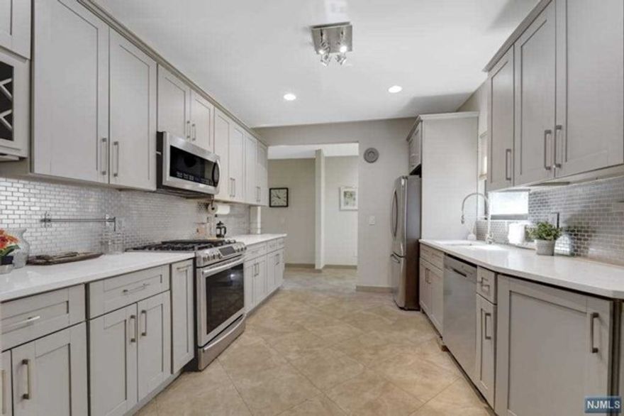 This stunning house situated in the heart of Englewood, just a few minutes walk away from the bustling downtown area, close to shopping, restaurants, and all the lively activities the area has to offer. The house has undergone a complete renovation about 5 years ago, and has been transformed with a chic and stylish design that is sure to impress. As you enter the house, you'll be greeted by an entry foyer that leads into a welcoming living room with a fireplace. The first floor also features a formal dining room. The kitchen is equipped with sleek cabinets and silver appliances, quartz countertops, and a convenient powder room and mudroom complete the first floor. Upstairs, you'll find the master suite with its own luxurious bathroom, along with two additional bedrooms and a main bathroom. The third level has been thoughtfully finished, and provides an extra bonus space. lanscape provided by Landlord. Required is lease application, background check and proof of income.