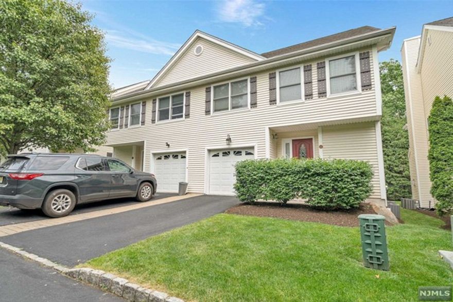 Location, Location! Close to NYC transportation by bus train or car, convenient to shopping and restaurants, Blue Ribbon School District.This townhouse has a wonderful flow for living and entertaining. Living room with fireplace dining room sliders to deck plus powder room/laundry. Second floor features primary suite with walk in closet, bathroom with double sinks plus two additional bedrooms and full bath.Finished lower level with with tons of storage.