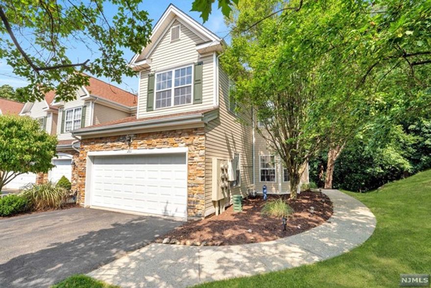 Exceptional, rare, extra large (2318 sq ft + large walk-out basement=3518 sq ft of total living space) end unit located on the Ridge Drive cul-de-sac in Summit Falls. Amenities include: Central a/c, large 2-car attached garage, 4-car driveway, 2 fireplaces, large primary bedroom suite, 1st floor sitting room/office, 2nd floor laundry w/newer washer & dryer, private back deck and patio & community pool. You do not want to miss this very spacious home loaded with amenities in beautiful Pompton Lakes!