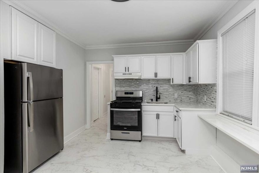 Welcome Home to this newly renovated 2 BR apartment in the center of town.. Walking distance to shops, restaurants, transportation, and laundry across the street! Minutes to NYC! Eat in kitchen with granite counter tops and new stainless steel appliances. Spacious living room with hardwood floors though out. Extra bonus room that can be used as an office or master closet.. Private outdoor deck can be used for a BBQ.. Ready to move In Available ASAP...