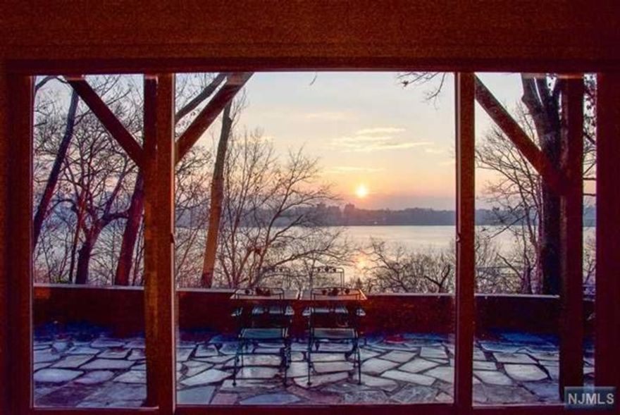 Private oasis on the Hudson. Secluded home. 3 levels of living space.. with entry level living room with walls of windows facing the Hudson Rvr and NYC, with 2 bedrooms and a full bath,& a huge outdoor bluestone patio. Peaceful setting in the woods with great privacy. Parking for several cars. Lower level with large dining/living area,full kitchen, laundry area and half bath. Upper level is a huge studio ( approx. 750 sq. ft) with eastern and southern views, full bath and wraparound deck.