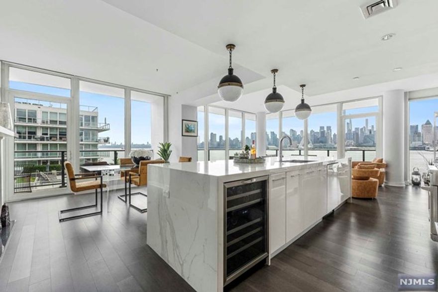 Presenting a spectacular 3BR/3BA,1,938sf residence at The Avenue Collection with unbelievable views of NYC/Hudson River. Open layout floorplan, floor-to-ceiling windows with panoramic views of the City. Chef-inspired kitchen with GE Monogram appliances, wine refrigerator & center island, flowing to the living & dining room, gas fireplace, balcony off dining, & immense wraparound balcony. Primary ensuite has a WIC & spa-like bath featuring dual vanities w/Caesarstone counters, soaking tub & shower. 2nd BR ensuite & generously sized 3rd BR w/direct views of the city/river & full bath outside. Floor-to-ceiling windows, wood floors & motorized blinds throughout. In-unit W/D & 2-car tandem garage parking. Amenities: 24hr concierge, library lounge, fitness center w/ steam shower & sauna, children's playroom, cinema room, skyline social lounge, cold storage, outdoor pool, firepit & bicycle storage. Close to Ferry/Bus/Light Rail.