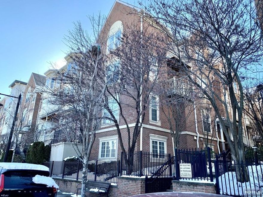 12 year old townhome. Large Boston Model with 2 covered parking spaces. Central air. 9'ceiling on lower level. Upgraded with builder's platinum package. Granite countertop, Stainless Steel appliances, Recently installed Navien tankless water heater, added storm door to 2nd-level terrace, Recessed lights in Kitchen, living room & Master Bedroom. Ceiling fans in both bedrooms. Refrigerator, Dishwasher, Washer, Dryer & Microwave included. Beautiful hardwood floors throughout both levels. Flood insurance covered by HOA fees. Living Rm: 14'6x20', Dining Rm: 12'4x14'2, Eat-in Kitchen: 11'3x12', Bedrooms: 10'4x13'8 & 12'5x17'2. Den in Loft between 2 bedrooms. 2 terraces - one on each level. Walk to Path Station in 12 minutes. 15 year pilot tax program - property taxes remain at $7,933 a year for the rest of 3 years. Corner unit. Eastern & Northern exposure. One domestic pet under 40 lbs is allowed. Offers need to be pre-approved by a portfolio lander.