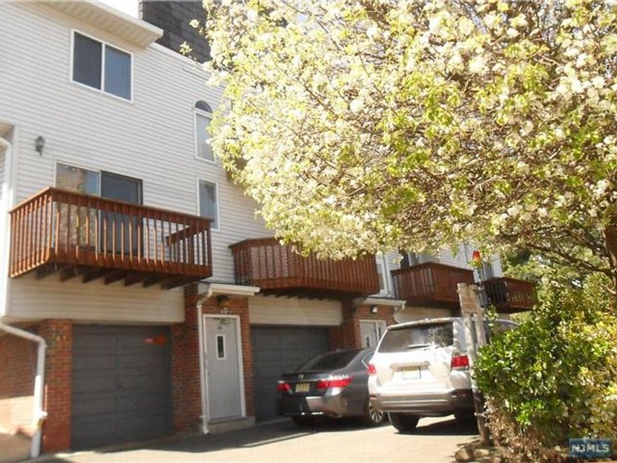 Bright and spacious two story Condo located in the Fairmount section. Boasting Liv rm w/Fireplace and sliding door out to the balcony. Central air, Spacious closets, oversized garage and 2 parking spaces The apt has been freshly painted and new carpeting installed. Nicely landscaped grounds and easy access to shopping and transportation