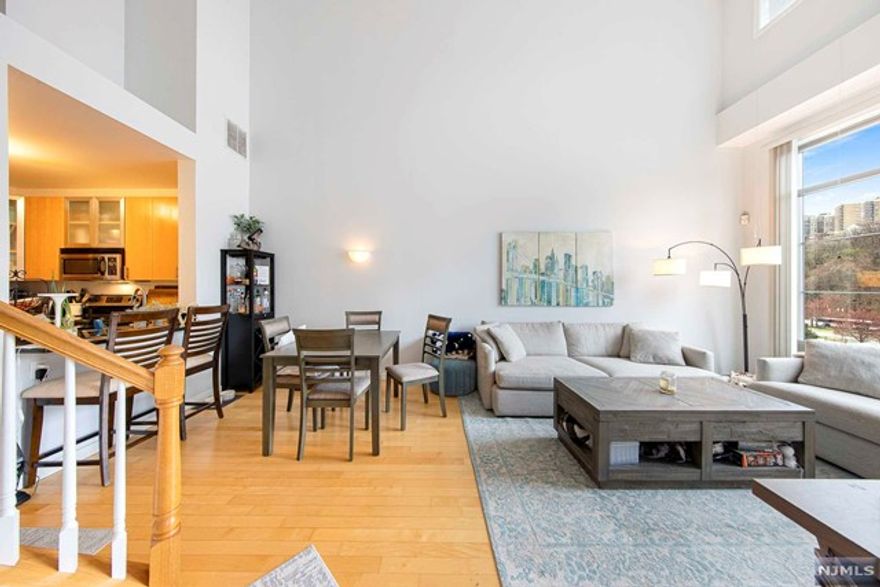 Beautiful 2 bedroom duplex with loft like Feeling, 18 ft. ceiling and floor to ceiling windows in living room/dining room area. Kitchen has contemporary cabinetry, all stainless appliances, and granite counter tops, new carpeting on stairs and just painted in updated color palate.There is lots of closet space.The amenities include doorman,security, pool, health club, and children's play area.This is an excellent commuter location to NYC, walking distance to Light Rail and ferry, plus shuttle bus to Port Imperial ferry also available.Community offerspool,gym,clubhouse,resident lounge,Shopping is at your doorstep.One parking space in garage is also included.**REQUIRED FOR APPROVAL COMPLETED APPLICATION FORM - TENANT REPORT FOR EACH APPLICANT + PROOF OF INCOME** *REQUIRED FOR MOVE-IN - 1st month rent + 1.5 month security + 1 month realty fee